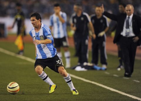 Argentine footballer Lionel Messi runs with the ball during a football match in Kolkata on September 2, 2011. Argentina's football team, lead by the newly elected captain Lionel Messi, beat Venezuela 1-0 in the first ever FIFA Friendly International Match on the Indian subcontinent. AFP PHOTO/ Dibyangshu SARKAR (Photo credit should read DIBYANGSHU SARKAR/AFP/Getty Images)