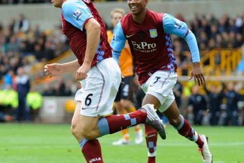 WOLVERHAMPTON, ENGLAND - SEPTEMBER 26:  Stuart Downing of Aston Villa celebrates scoring to make it 1-0 with Ashley Young during the Barclays Premier League match between Wolverhampton Wanderers and Aston Villa at Molineux on September 26, 2010 in Wolverhampton, England.  (Photo by Michael Regan/Getty Images)