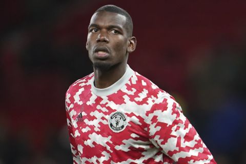 Manchester United's Cristiano Ronaldo, right, and Manchester United's Paul Pogba warm up prior to the English FA Cup fourth round soccer match between Manchester United and Middlesbrough at Old Trafford stadium in Manchester, England, Friday, Feb. 4, 2022. (AP Photo/Jon Super)