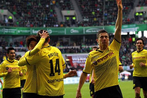 WOLFSBURG, GERMANY - APRIL 07:  Robert Lewandowski (R) of Dortmund celebrates after he scores his team's opening goal during the Bundesliga match between VfL Wolfsburg and Borussia Dortmund at the Volkswagen Arena on April 7, 2012 in Wolfsburg, Germany.  (Photo by Martin Rose/Bongarts/Getty Images)