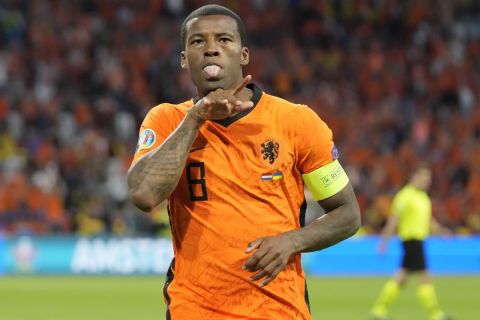 Georginio Wijnaldum of the Netherlands celebrates after scoring his side's opening goal during the Euro 2020 soccer championship group C match between the Netherlands and Ukraine at the Johan Cruijff Arena in Amsterdam, Netherlands, Sunday, June 13, 2021. (AP Photo/Peter Dejong, Pool)