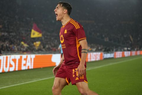 Roma's Paulo Dybala celebrates after scoring his team's secnd goal during the Europa League quarterfinal second leg soccer match between Roma and AC Milan, at Rome's Olympic Stadium, Thursday, April 18, 2024. (AP Photo/Andrew Medichini)