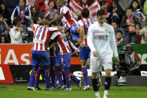 Sporting Gijons players celebrate after scoring second goal against Sevilla during their Spanish first league football match at the Molinon Stadium in Gijon, on October 17, 2010. AFP PHOTO / MIGUEL RIOPA (Photo credit should read MIGUEL RIOPA/AFP/Getty Images)