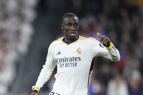 Real Madrid's Ferland Mendy runs with the ball during the Spanish La Liga soccer match between Real Madrid and Sevilla at the Santiago Bernabeu stadium in Madrid, Spain, Sunday, Feb. 25, 2024. (AP Photo/Manu Fernandez)