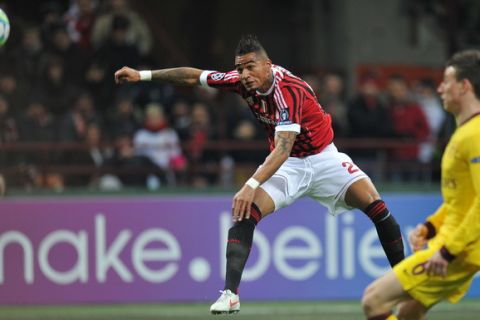 AC Milan's Ghanaian defender Prince Kevin Boateng shoots and scores against  Arsenal, during the UEFA Champions League round of 16 first leg match AC Milan vs Arsenal at San Siro stadium on February 15, 2012 in Milan. AFP PHOTO / ANDREAS SOLARO (Photo credit should read ANDREAS SOLARO/AFP/Getty Images)