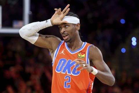 Oklahoma City Thunder guard Shai Gilgeous-Alexander celebrates during the second half of a semifinal game against the Houston Rockets in the NBA Cup basketball tournament Saturday, Dec. 14, 2024, in Las Vegas. (AP Photo/Ian Maule)