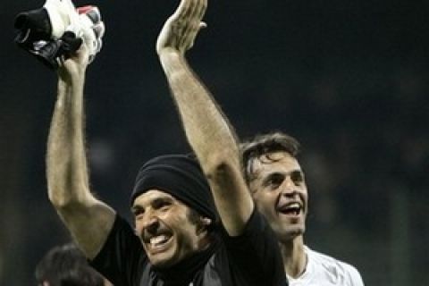 Juventus goalkeeper Gianluigi Buffon, left, and Juventus defender Nicola Legrottaglie celebrate after the Italian first division soccer match between Inter Milan and Juventus at the San Siro stadium in Milan, Italy, Saturday, March 22, 2008. Juventus won 2-1. (AP Photo/Antonio Calanni)         