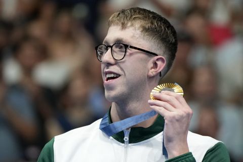 Gold medalist Daniel Wiffen of Ireland holds his gold medal for the men's 800-meter freestyle final at the 2024 Summer Olympics, Monday, Tuesday, July 30, 2024. (AP Photo/Matthias Schrader)