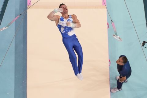 Eleftherios Petrounias, of Greece, performs on the rings during a men's artistic gymnastics qualification round at the 2024 Summer Olympics, Saturday, July 27, 2024, in Paris, France. (AP Photo/Morry Gash)