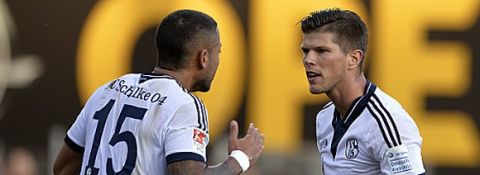 FREIBURG GERMANY - NOVEMBER 8: Klaas-Jan Huntelaar (R) of Schalke 04 speaks with Dennis Aogo during the Bundesliga match between SC Freiburg and FC Schalke 04 at Schwarzwald Stadium on November 8, 2014 in Freiburg, Germany.  (Photo by Michael Kienzler/Bongarts/Getty Images)