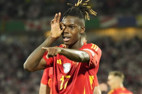 Spain's Nico Williams celebrates after scoring his side's 3rd goal against Georgia during a round of sixteen match at the Euro 2024 soccer tournament in Cologne, Germany, Sunday, June 30, 2024. (AP Photo/Frank Augstein)