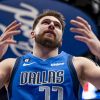 Dallas Mavericks guard Luka Doncic (77) throws his hands up after drawing a foul on a made basket in the first half of an NBA game against the Cleveland Cavaliers in Dallas, Texas, Wednesday, Dec. 14, 2022. (AP Photo/Emil Lippe)