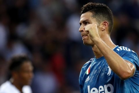 Juventus' Cristiano Ronaldo celebrates at the end of the Serie A soccer match between Parma and Juventus at the Tardini stadium, in Parma, Italy, Saturday, Aug. 24, 2019. (AP Photo/Antonio Calanni)