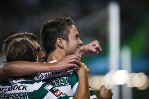 Sporting's dutch forward, Ricky van Wolfswinkel celebrates with his teamates  the goal scored by him agianst Setubal during their Portuguese first league football match at the Alvalade Stadium in Lisbon on September 24, 2011. AFP PHOTO/ PATRICIA DE MELO MOREIRA (Photo credit should read PATRICIA DE MELO MOREIRA/AFP/Getty Images)