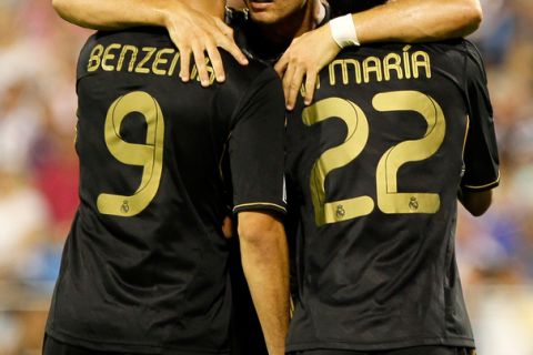 Real Madrid's Portuguese forward Cristiano Ronaldo (C) celebrate with Real Madrid's Argentinian midfielder Angel Di Maria (R) and Real Madrid's French forward Karim Benzema after scoring his second goal against Zaragoza during their Spanish league football match at La Romareda stadium in Zaragoza on August 28, 2011. AFP PHOTO/ CESAR MANSO (Photo credit should read CESAR MANSO/AFP/Getty Images)