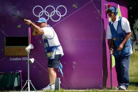 LONDON, ENGLAND - JULY 23:  Abdullah Al Rashdi of Kuwait watches as Nikolaos Mavrommatis of Greece trains for the Men's Skeet event in advance of the 2012 Olympic Games on July 23, 2012 at the Royal Artillery Barracks in London, England.  (Photo by Jamie Squire/Getty Images)