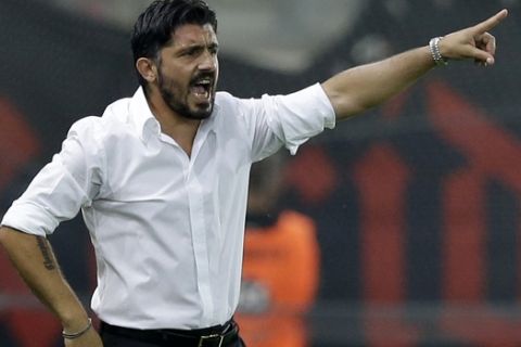 OFI's coach Gennaro Gattuso of Italy gives instructions to his players during a Greek Soccer League match at the Georgios Karaiskakis stadium against Olympiacos in the port of Piraeus, near Athens on Saturday, Sept. 13, 2014. (AP Photo/Thanassis Stavrakis)