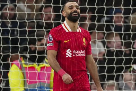 Liverpool's Mohamed Salah celebrates after scoring his side's fourth goal during the English Premier League soccer match between Tottenham and Liverpool at Tottenham Hotspur Stadium in London, Sunday, Dec. 22, 2024. (AP Photo/Dave Shopland)