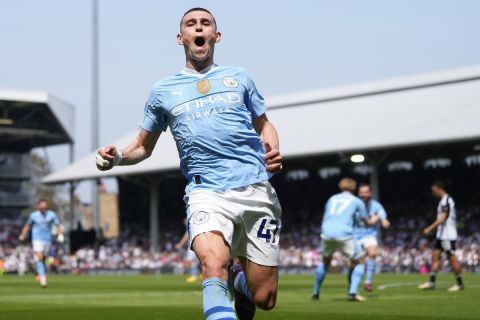 Manchester City's Phil Foden celebrates after scoring his side's second goal during the English Premier League soccer match between Fulham and Manchester City at the Craven Cottage Stadium in London, Saturday, May 11, 2024. (AP Photo/Kirsty Wigglesworth)