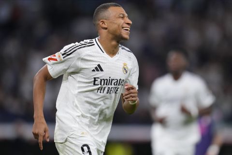 Real Madrid's Kylian Mbappe celebrates after he scored his team's fourth goal against Espanyol during a Spanish La Liga soccer match at Santiago Bernabeu stadium in Madrid, Spain, Saturday, Sept. 21, 2024. (AP Photo/Manu Fernandez)