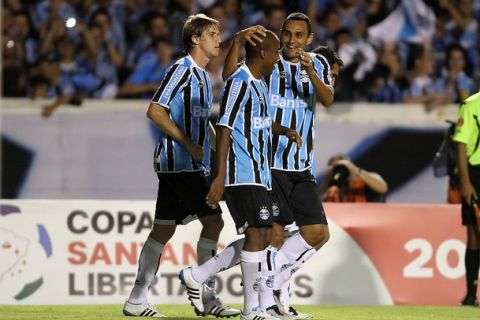 Gremio's Borges (C) celebrates with teammates his goal against Junior de Barranquilla during their Libertadores Cup footbal match on April 07, 2011 at Olimpico Monumental stadium in Porto Alegre, Brazil. AFP   PHOTO  JEFFERSON BERNARDES (Photo credit should read JEFFERSON BERNARDES/AFP/Getty Images)