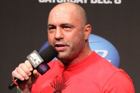 UFC announcer Joe Rogan is seen at the weigh in before a UFC on FOX 5 event in Seattle, Friday, Dec. 7, 2012. (AP Photo/Gregory Payan)