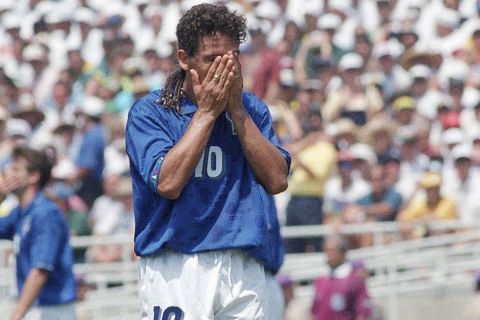 Italy's Roberto Baggio holds his head in his hands at the end of regulation World Cup time, Sunday, July 17, 1994, at the Rose Bowl in Pasadena, Calif. Baggio's missed goal in overtime left the Italians on the losing end of the XV World Cup Final against Brazil, 3-2. (AP Photo/Thomas Kienzle)