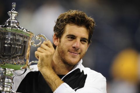 Tennis player Juan Martin Del Potro of Argentina holds his trophy after beating Roger Federer of Switzerland in the final of the 2009 US Open at the USTA Billie Jean King National Tennis Center in New York, September 14, 2009.  Del Potro won 3-6, 7-6, 6-4, 7-6, 6-2. AFP PHOTO/Emmanuel Dunand (Photo credit should read EMMANUEL DUNAND/AFP/Getty Images)