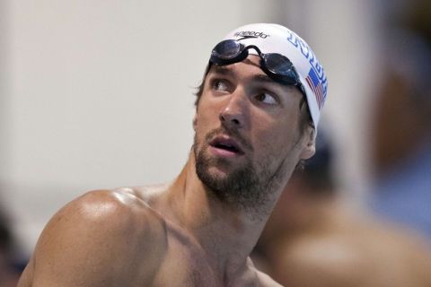 Michael Phelps looks up before swimming in the men's 200 meter freestyle race during the USA Swimming Grand Prix Charlotte Ultra Swim in Charlotte, North Carolina May 13, 2011. REUTERS/Chris Keane (UNITED STATES - Tags: SPORT SWIMMING)