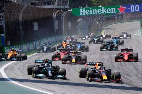 Mercedes' Veltteri Bottas, left, and Red Bull's Max Verstappen steer their cars at the start of the Brazilian Formula One Grand Prix at the Interlagos race track in Sao Paulo, Brazil, Sunday, Nov. 14, 2021. (AP Photo/Andre Penner)