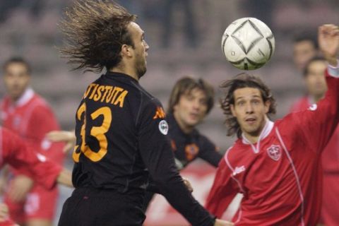 Roma's Gabriel Omar Batistuta of Argentina, front left, eyes the ball as Triestina's   Michele Bacis, right, looks on during the Coppa Italia Italy Cup soccer match between Roma and Triestina in Trieste, Italy, Wednesday Dec. 4, 2002. (AP  Photo/Franco Debernardi)