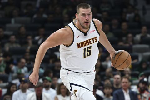 Denver Nuggets Nikola Jokic in action during a preseason game between Boston Celtics and Denver Nuggets in Abu Dhabi, United Arab Emirates, Friday, Oct. 4, 2024. (AP Photo/Martin Dokoupil)