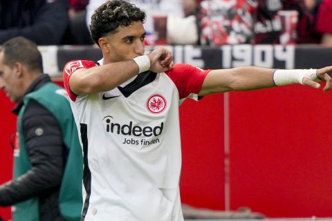 Frankfurt's Omar Marmoush celebrates after scoring his side's opening goal during the German Bundesliga soccer match between Bayer Leverkusen and Eintracht Frankfurt at the BayArena in Leverkusen, Germany, Saturday, Oct. 19, 2024. (AP Photo/Martin Meissner)