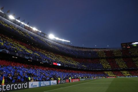 Barcelona fans show the club flag before the Champions League semifinal, first leg, soccer match between FC Barcelona and Liverpool at the Camp Nou stadium in Barcelona, Spain, Wednesday, May 1, 2019. (AP Photo/Emilio Morenatti)