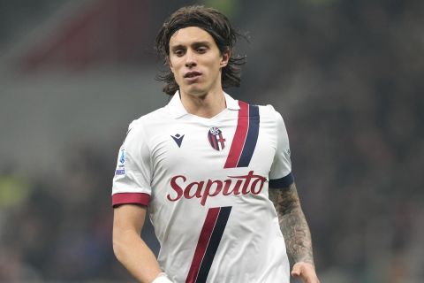 FILE - Bologna's Riccardo Calafiori controls the ball during the Serie A soccer match between AC Milan and Bologna at the San Siro stadium, in Milan, Italy, Saturday, Jan. 27, 2024. Riccardo Calafiori has been named in the Italy squad for the first time after Bologna's impressive season. The squad will be reduced to 26 players by June 6. (AP Photo/Antonio Calanni)