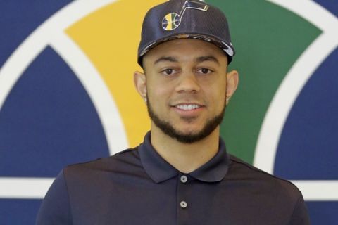 Utah Jazz's Nigel Williams-Goss poses for photos after the Jazz introduced their 2017 NBA Draft picks during a news conference Wednesday, June 28, 2017, in Salt Lake City. (AP Photo/Rick Bowmer)