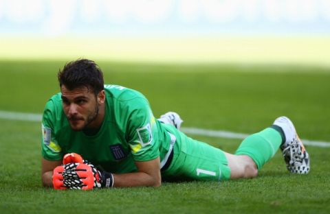 BELO HORIZONTE, BRAZIL - JUNE 14: Orestis Karnezis of Greece lies on the field after allowing a third goal to Colombia during the 2014 FIFA World Cup Brazil Group C match between Colombia and Greece at Estadio Mineirao on June 14, 2014 in Belo Horizonte, Brazil.  (Photo by Paul Gilham/Getty Images)