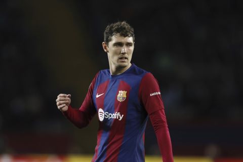 Barcelona's Andreas Christensen walks on pitch during the Champions League, round of 16, second leg soccer match between FC Barcelona and SSC Napoli at the Olympic Stadium in Barcelona, Spain, Tuesday, March 12, 2024. (AP Photo/Joan Monfort)