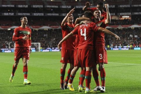 Portugal's players celebrate a goal against Bosnia-Herzgovina during their EURO 2012 play-off football match at Luz Stadium in Lisbon on November 15, 2011. AFP PHOTO/ BRUNO PIRES (Photo credit should read BRUNO PIRES/AFP/Getty Images)