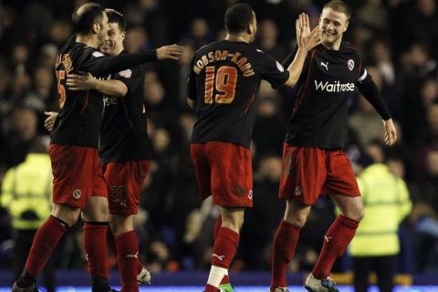 Reading's Matt Mills (R) celebrates with teammates after their English FA Cup soccer match against Everton at Goodison Park in Liverpool, northern England, March 1, 2011. REUTERS/Phil Noble (BRITAIN - Tags: SPORT SOCCER)