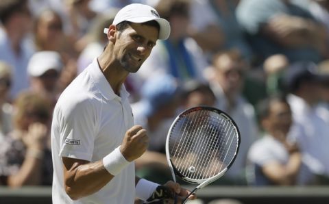 Serbia's Novak Djokovic celebrates winning a point during the men's singles final match against Kevin Anderson of South Africa, at the Wimbledon Tennis Championships, in London, Sunday July 15, 2018.(AP Photo/Kirsty Wigglesworth)