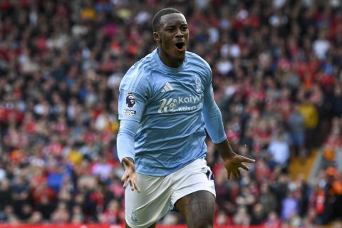 Nottingham Forest's Callum Hudson-Odoi celebrates scoring his side's opening goal during the English Premier League soccer match between Liverpool and Nottingham Forest at Anfield Stadium in Liverpool, England, Saturday, Sept. 14, 2024. (AP Photo/Rui Vieira)