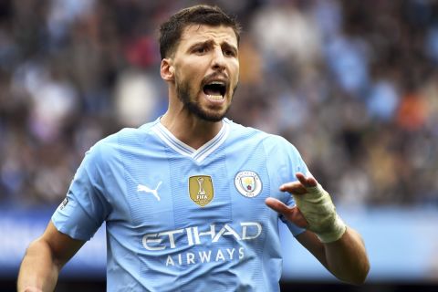 Manchester City's Ruben Dias during the English Premier League soccer match between Manchester City and Luton Town at Etihad stadium in Manchester, England, Saturday, April 13, 2024. (AP Photo/Rui Vieira)