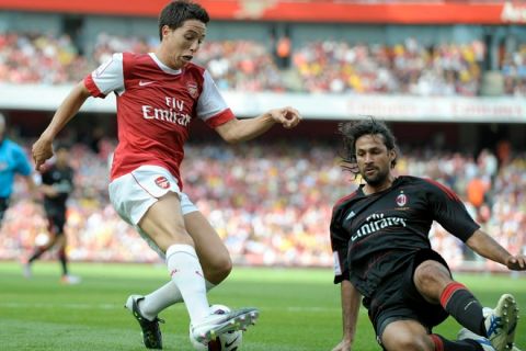 Arsenal's Samir Nasri (L) competes with AC Milan's Mario Alberto Yepes during their Emirates Cup football match at Emirates Stadium in London, England on July 31, 2010.  AFP PHOTO/Olly Greenwood

FOR EDITORIAL USE ONLY Additional license required for any commercial/ promotional use or use on TV or internet (except identical online version of newspaper) of Premier League/Football photos. Tel DataCo  
+44 207 2981656. Do not alter/modify photo. (Photo credit should read OLLY GREENWOOD/AFP/Getty Images)(Photo Credit should Read /AFP/Getty Images)