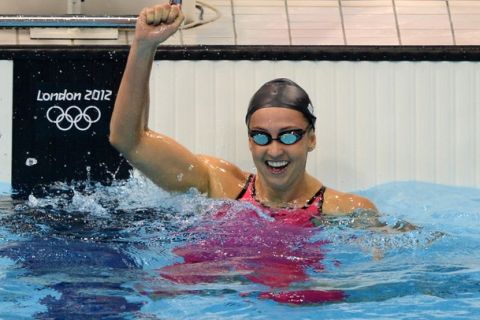 US swimmer Rebecca Soni celebrates after breaking the world record  in the women's 200m breaststroke semi-finals swimming event at the London 2012 Olympic Games on August 1, 2012 in London.  AFP PHOTO / CHRISTOPHE SIMON        (Photo credit should read CHRISTOPHE SIMON/AFP/GettyImages)