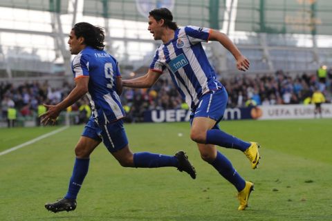 CORRECTION RIGHT PLAYER'S NAME IN CAPTION
FC Porto's Colombian forward Falcao (L) celebrates with FC Porto's Romanian defender Cristian Sapunaru after scoring during the UEFA Europa League final football match FC Porto vs SC Braga on May 18, 2011 the Aviva Stadium in Dublin.     AFP PHOTO/ FRANCISCO LEONG (Photo credit should read FRANCISCO LEONG/AFP/Getty Images)