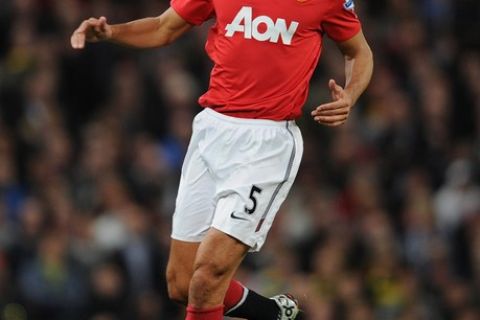 MANCHESTER, ENGLAND - OCTOBER 30:  Rio Ferdinand of Manchester United on the ball during the Barclays Premier League match between Manchester United and Tottenham Hotspur at Old Trafford on October 30, 2010 in Manchester, England.  (Photo by Michael Regan/Getty Images)