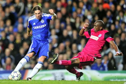 Chelsea's Spanish striker Fernando Torres (L) vies with KRC Genk's South African defender Anele Ngcongca (R) during the UEFA Champions League, group E football match against KRC Genk at Stamford Bridge, London, England, on October 19, 2011. AFP PHOTO/GLYN KIRK (Photo credit should read GLYN KIRK/AFP/Getty Images)