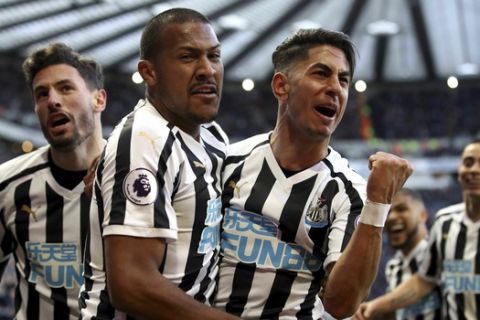 Newcastle United's Ayoze Perez, right, celebrates scoring against Everton during the English Premier League soccer match at St James' Park, Newcastle, England, Saturday March 9, 2019. (Owen Humphreys/PA via AP)