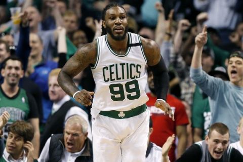 Fans react to a basket by Boston Celtics' Jae Crowder (99) during the fourth quarter of a second-round NBA playoff series basketball game against the Washington Wizards, Sunday, April, 30, 2017, in Boston. The Celtics won 123-111. (AP Photo/Michael Dwyer)